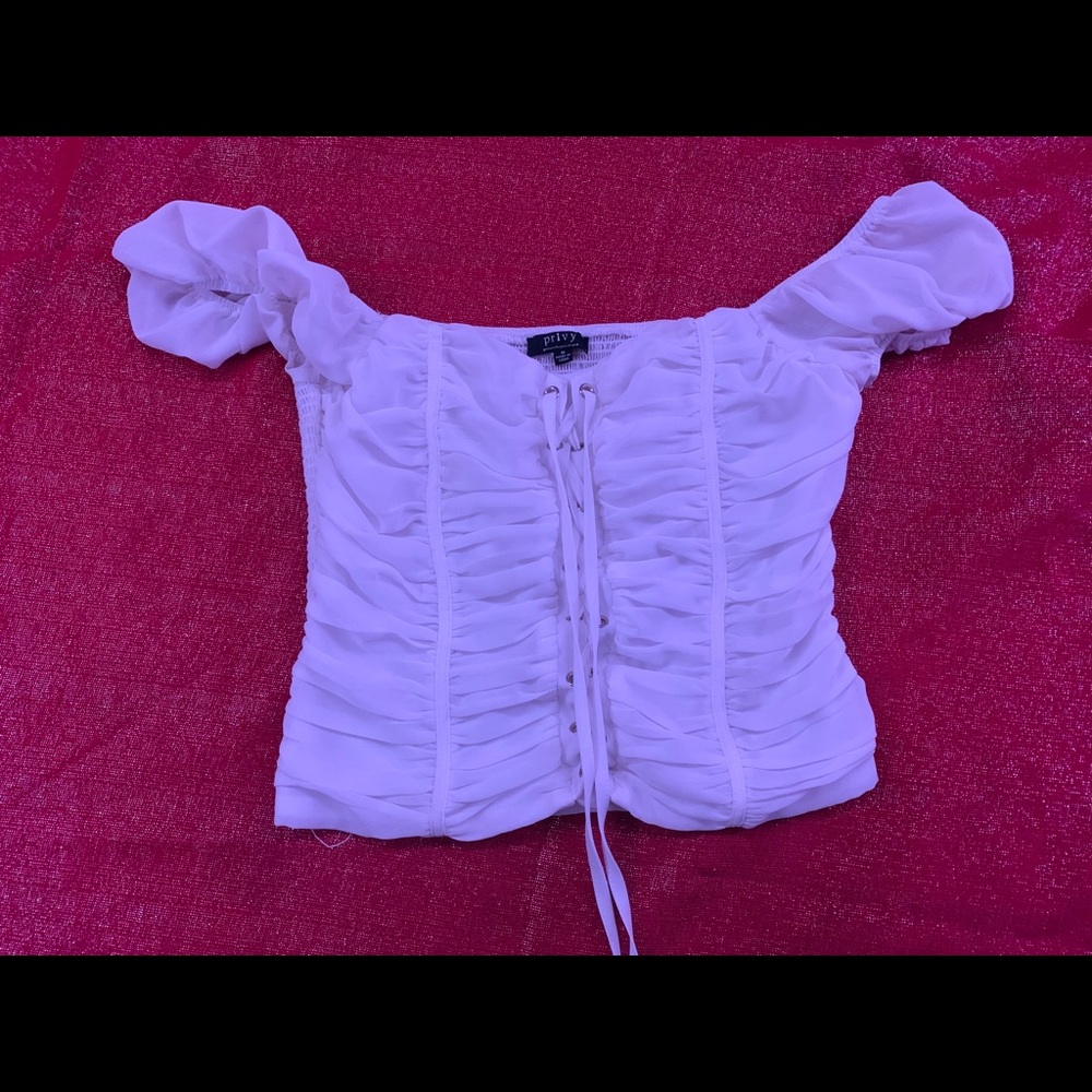 White shoulder strap shirt